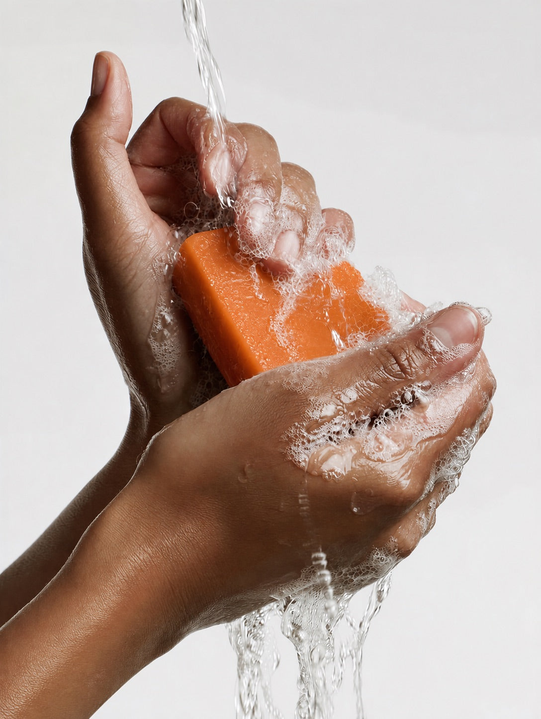 Hands creating lather with the ABLUVO body cleansing bar