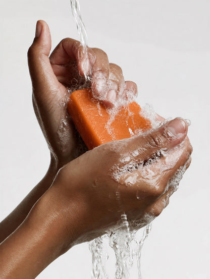 Hands creating lather with the ABLUVO body cleansing bar